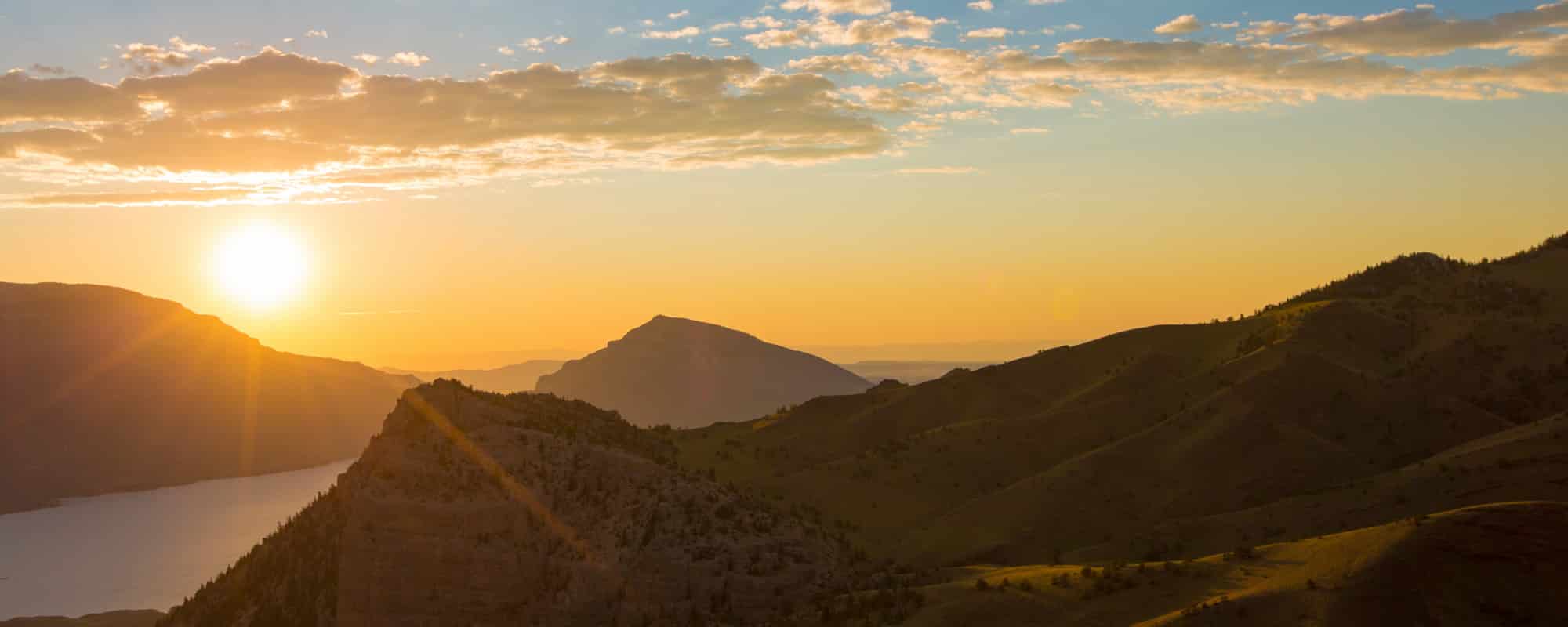Rattlesnake Cedar Sheep Mountain sunrise near Buffalo Bill Reservoir CREDIT Wyoming Office _6DQ6-2000X800