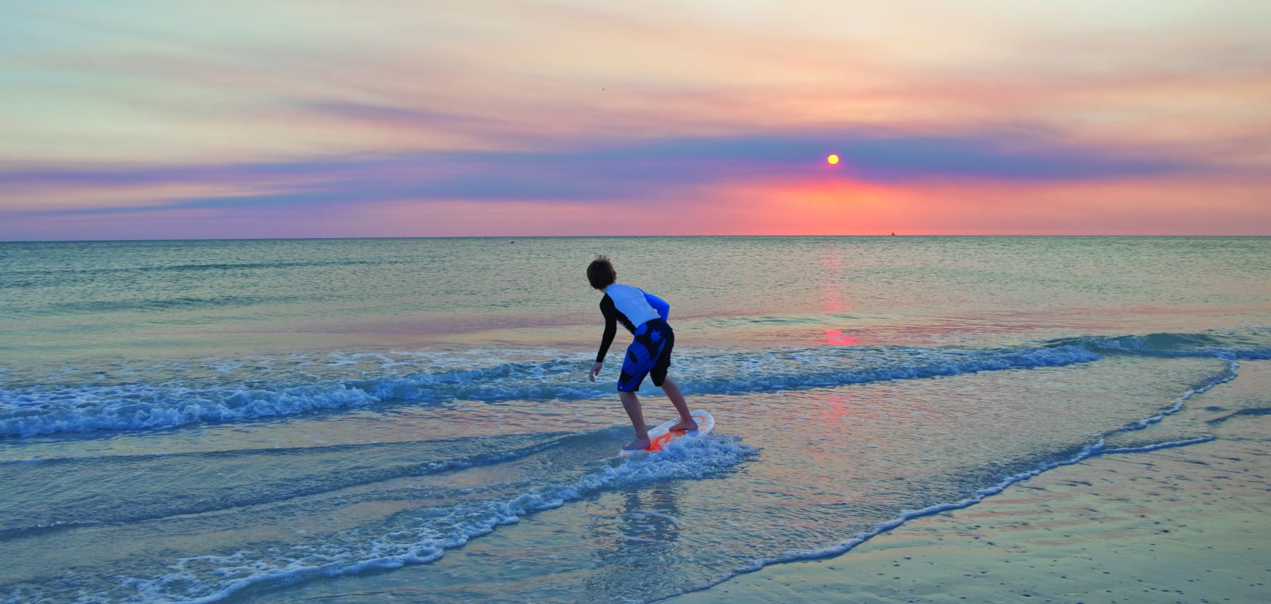 Skimboarding at Sunset