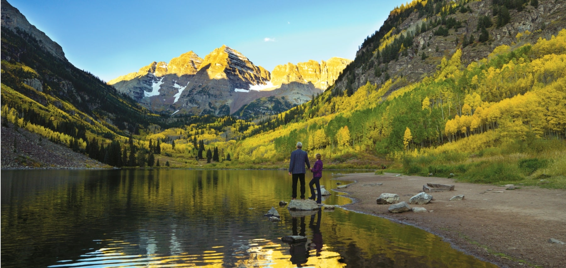 Couple at Maroon Bells in autumn, Aspen, Colorado