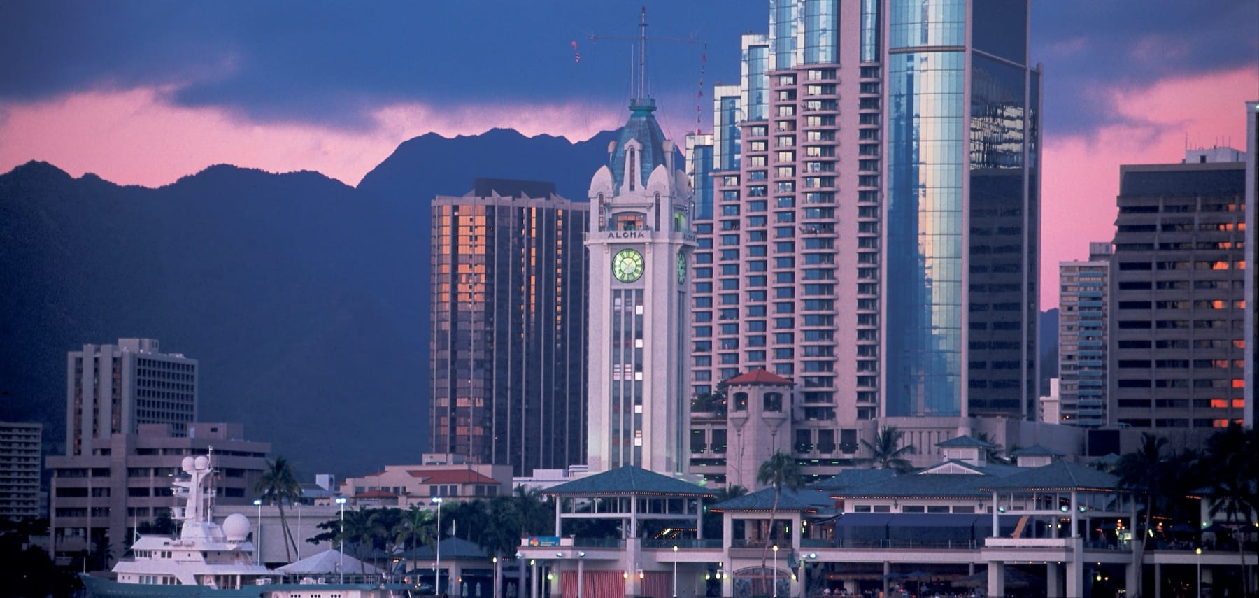 Aloha Tower Marketplace &amp; Downtown Honolulu Skyline at Sunset. Island of Oahu.
