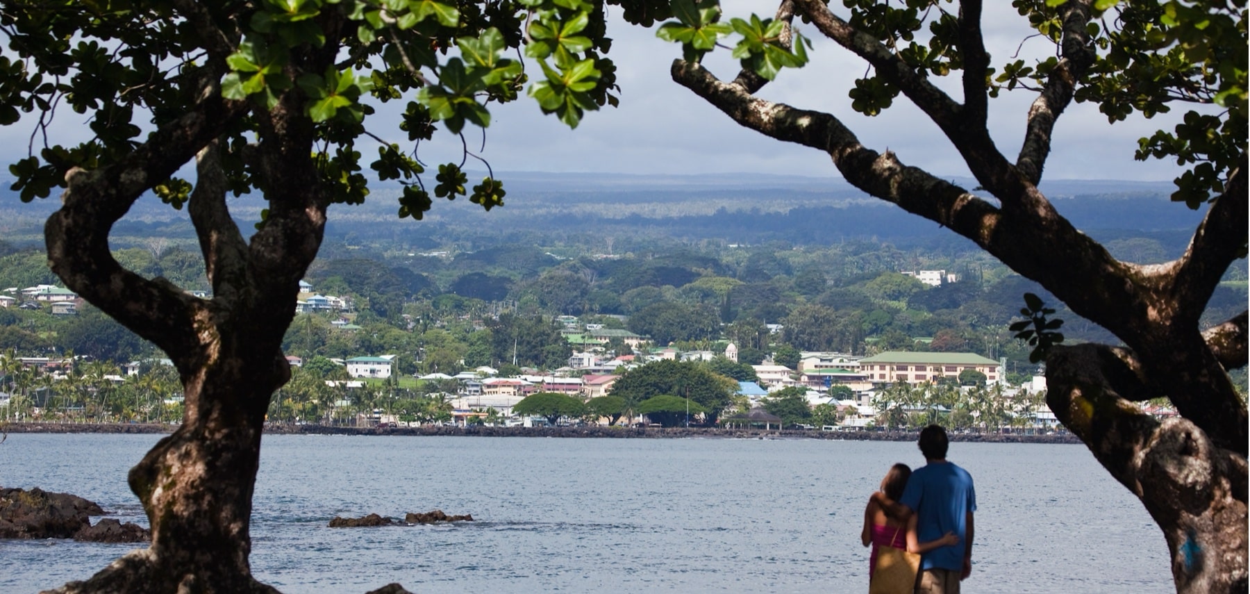 Couple looking across Hilo Bay