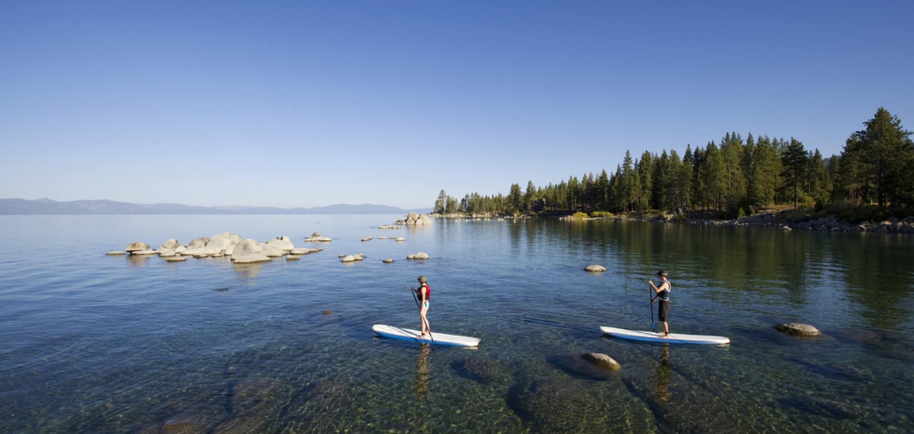 Lake Tahoe Two people stand up paddle boarding 1800